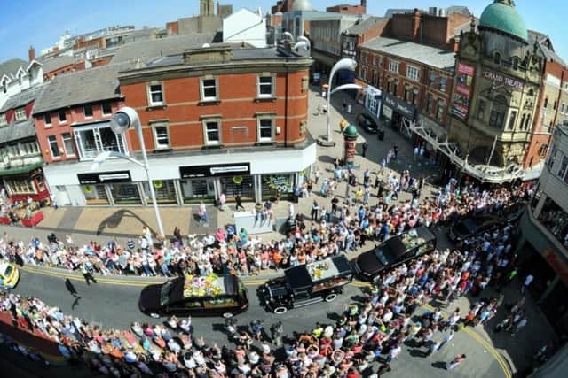Crowds watch the cortege of Bernie Nolan's funeral as it travels from the Grand Theatre up Corporation Street, Blackpool town centre, on the way to her service at Carleton Crematorium in 2013 (Picture: Iain Lynn for The Gazette)