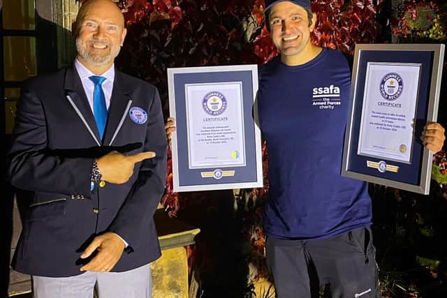 Jordan Wylie being presented with the Guinness World Record certificates