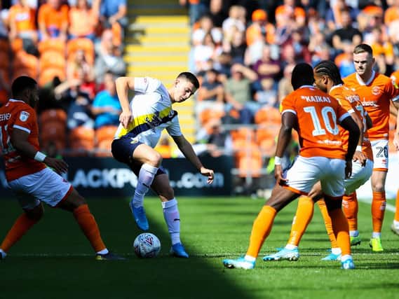 Ben Woodburn on the ball against Blackpool while on loan at Oxford last season