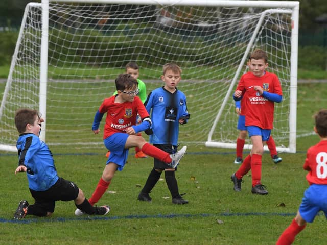 Under-9 action between FC Rangers and Kirkham Juniors Lightning Picture: NEIL CROSS