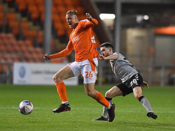 Dan Ballard, here challenged by Charlton's Paul Smyth, came on for his Blackpool debut after only three minutes