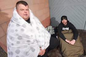 Big Ryan Smith (left) and Josh Morrison  try to keep warm during the rough sleep fundraiser