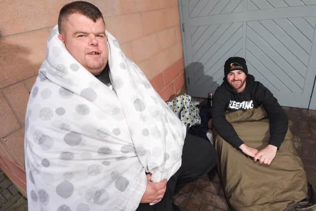 Big Ryan Smith (left) and Josh Morrison  try to keep warm during the rough sleep fundraiser