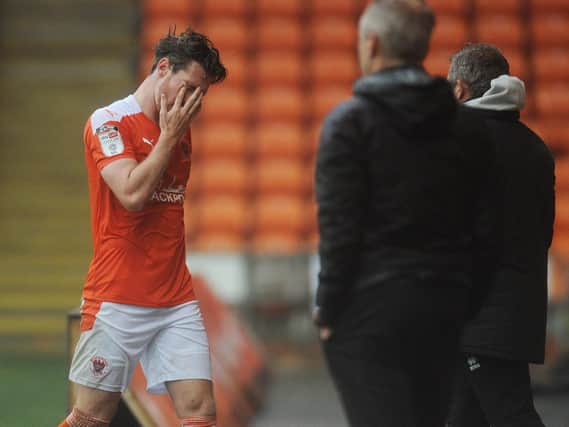 James Husband leaves the field after this month's first red card against Lincoln City