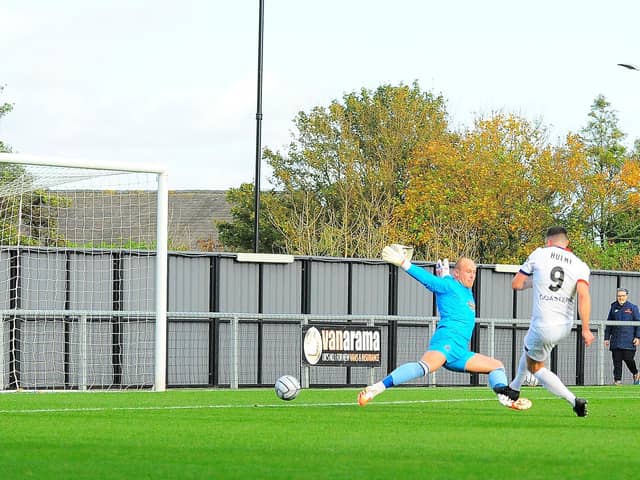 Jordan Hulme makes no mistake to open the scoring for Fylde against Altrincham
Picture: STEVE MCLELLAN