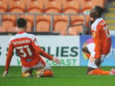 Sullay Kaika celebrates Saturday's winning goal with Ben Woodburn