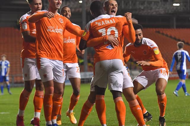 Blackpool celebrate Sullay Kaikai's goal against Wigan which brought about their first back-to-back wins of the season
