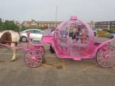 Councillors and officers inspect a Cinderella carriage