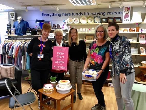 Manager Becca Andrew (centre) with colleagues at the shop