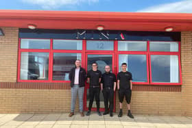 Jake Adams, second left, with members of the Mina Group team at the new offfices