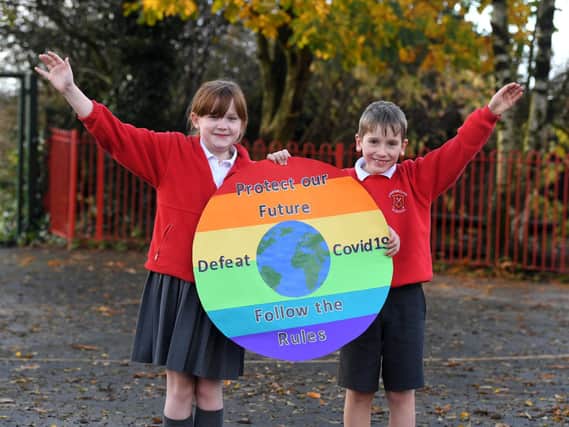 Youngsters at Longridge CE Primary have designed an eye-catching Covid-19 safety logo