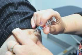 An undated file image of a person receiving a vaccination in jab form