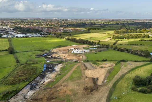 New drone images show land south of Garstang Road looking north showing the archaeology works, site cabins and the line of the new road
