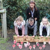 Gateway headteacher Sue Robinson with reception class pupils and their hand made poppies