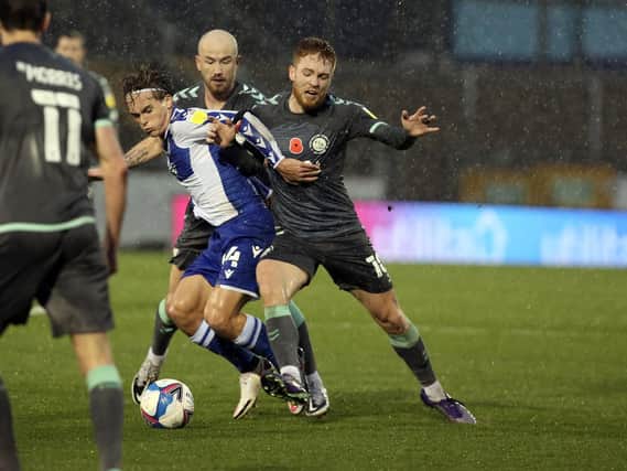 Two-goal Callum Camps tussles with Bristol Rovers' Luke McCormick