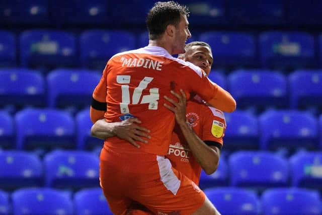 Gary Madine celebrates his last-minute winner with CJ Hamilton