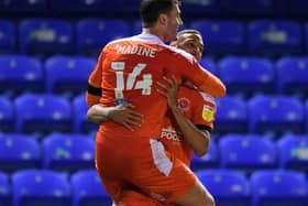 Gary Madine celebrates his last-minute winner with CJ Hamilton