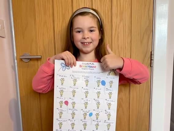 Caitlyn Maclean with her prize draw chart