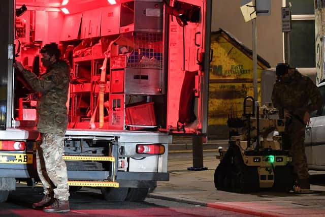 Bomb disposal teams have been called to inspect the package. (Photo by Dave Nelson)