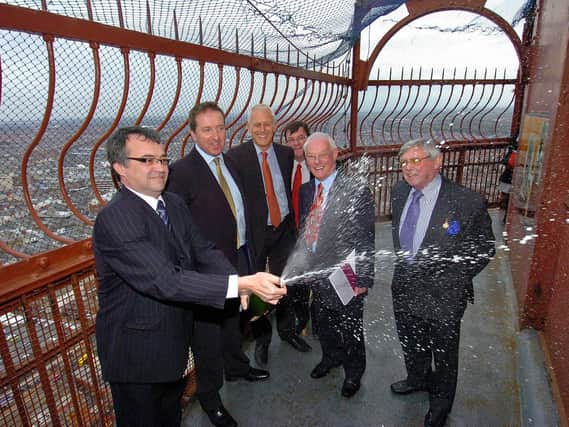 Coun Peter Callow with dignitaries including Gordon Marsden celebrate the deal to buy assets including Blackpool Tower in 2010