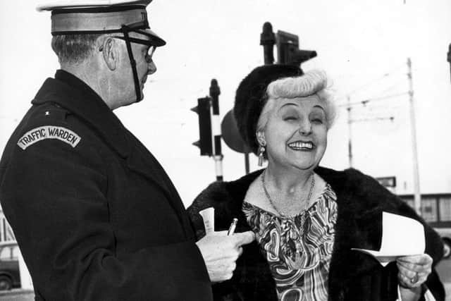 Tessie O’Shea is greeted by a traffic warden offering a friendly warning about her parking as she left a press conference in 1968