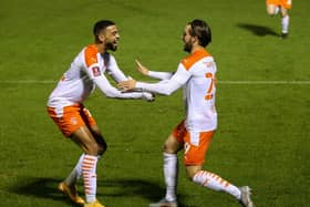 Luke Garbutt (right) celebrates the goal which broke the deadlock in the FA Cup at Harrogate with CJ Hamilton