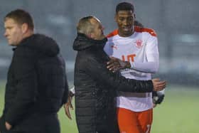 Neil Critchley with Marvin Ekpiteta at the full-time whistle