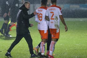 Neil Critchley congratulates his Blackpool players after the FA Cup win at Harrogate
