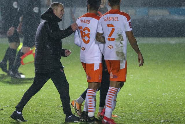 Neil Critchley congratulates his Blackpool players after the FA Cup win at Harrogate