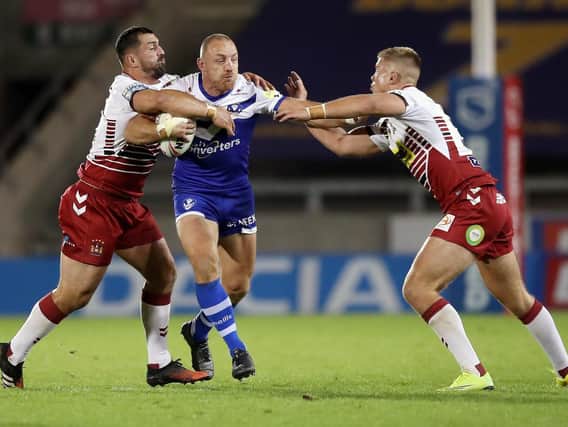Harry Rushton (right) in action for Wigan on his Super League debut against St Helens