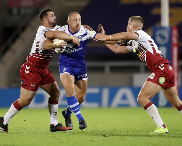 Harry Rushton (right) in action for Wigan on his Super League debut against St Helens
