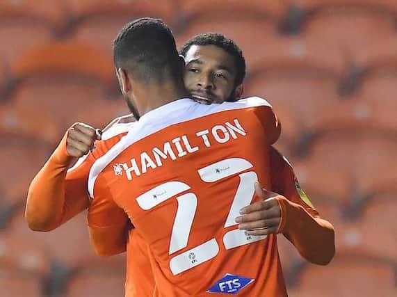 Keshi Anderson celebrates his winning goal with CJ Hamilton