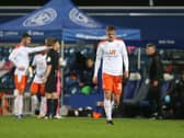 Ballard trudges off the pitch after being sent off in Blackpool's defeat at Wimbledon