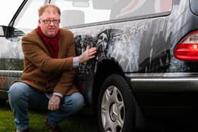 Darren Abey with his latest addition to his fleet, a special armed forces hearse. Photo: Kelvin Stuttard