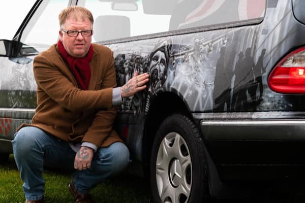 Darren Abey with his latest addition to his fleet, a special armed forces hearse. Photo: Kelvin Stuttard