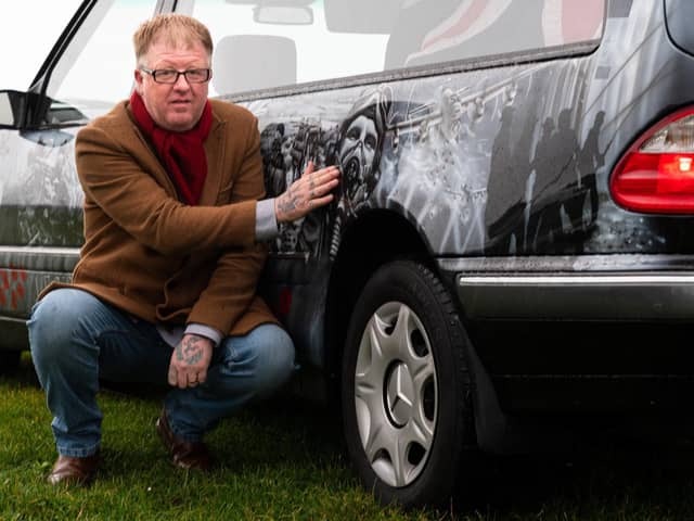 Darren Abey with his latest addition to his fleet, a special armed forces hearse. Photo: Kelvin Stuttard