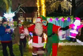 Father Christmas and an elf get into the spirit of things at the Conifers Care Home in Thornton