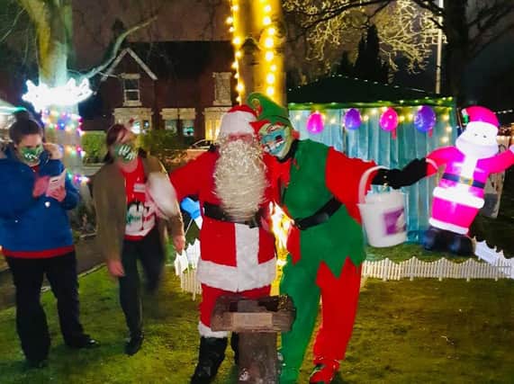 Father Christmas and an elf get into the spirit of things at the Conifers Care Home in Thornton