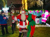 Father Christmas and an elf get into the spirit of things at the Conifers Care Home in Thornton