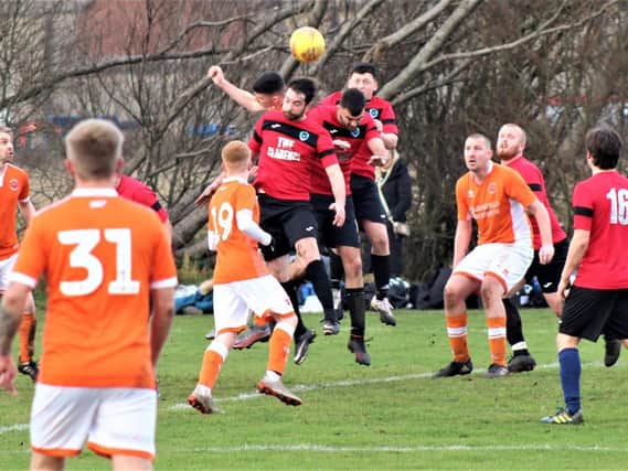 Action from the encounter between Clarence and Bloomfield Brewhouse as Sunday league action returned to the Fylde coast  Picture: KAREN TEBBUTT