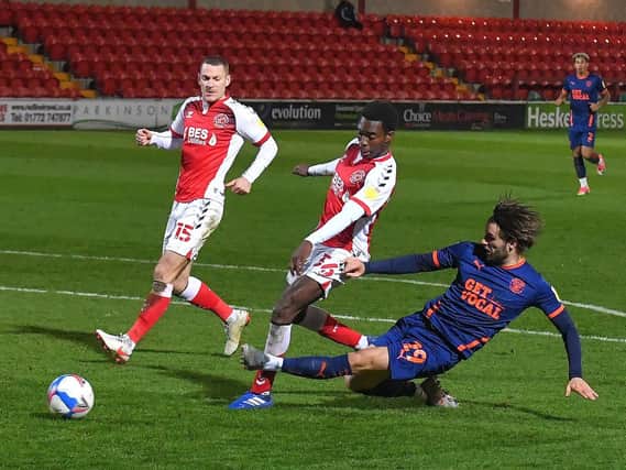 Luke Garbutt gets a cross over for Blackpool at Highbury on Tuesday