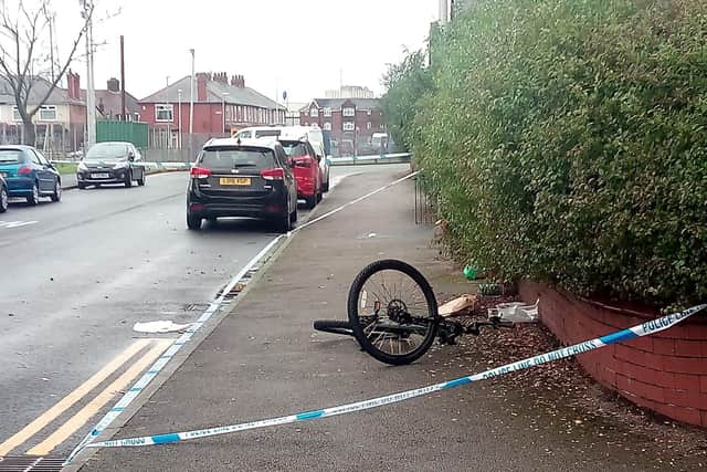 Kris Kam's bicycle, which he had been dragged from during the attack, lies abandoned at the side of the road, October 26 2019