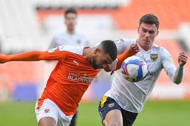 CJ Hamilton is challenged by Oxford's Josh Ruffels