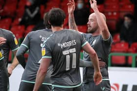 Paddy Madden celebrates his winning goal at Swindon