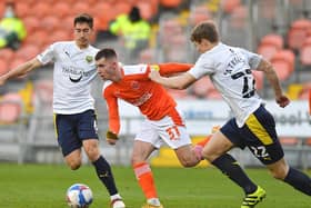 Blackpool's Ben Woodburn in action against his former club