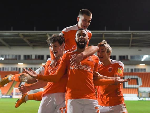 Blackpool's players celebrate CJ Hamilton's stoppage-time winner