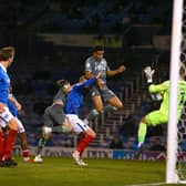 Fleetwood substitute James Hill is denied by Portsmouth keeper Craig MacGillivray