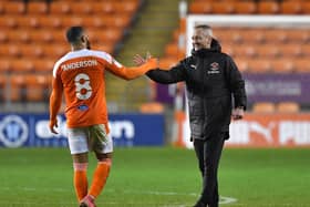 Blackpool boss Neil Critchley congratulates Keshi Anderson after the midweek win over Hull