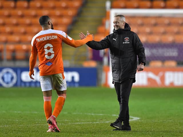 Blackpool boss Neil Critchley congratulates Keshi Anderson after the midweek win over Hull