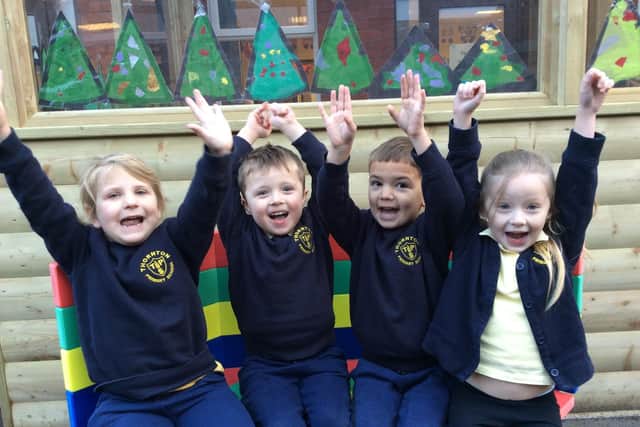 Reception pupils Isla Ganderton, Cole Price, Winston Richards Smith and Millie Badenoch are excited about their new buddy bench, which was donated to Thornton Primary School by McCarthy and Stone retirement property builders.